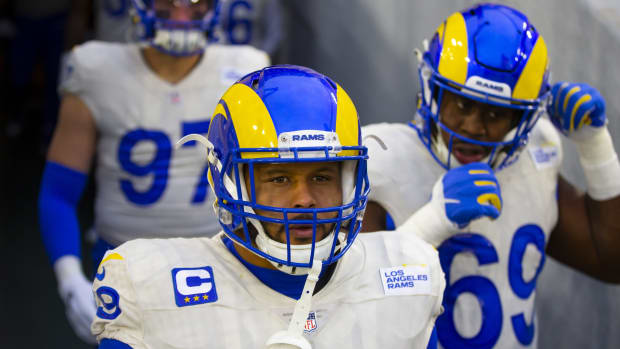 Jan 16, 2021; Green Bay, Wisconsin, USA; Los Angeles Rams defensive tackle Aaron Donald (99) against Green Bay Packers during the NFC Divisional Round at Lambeau Field. Mandatory Credit: Mark J. Rebilas-USA TODAY Sports